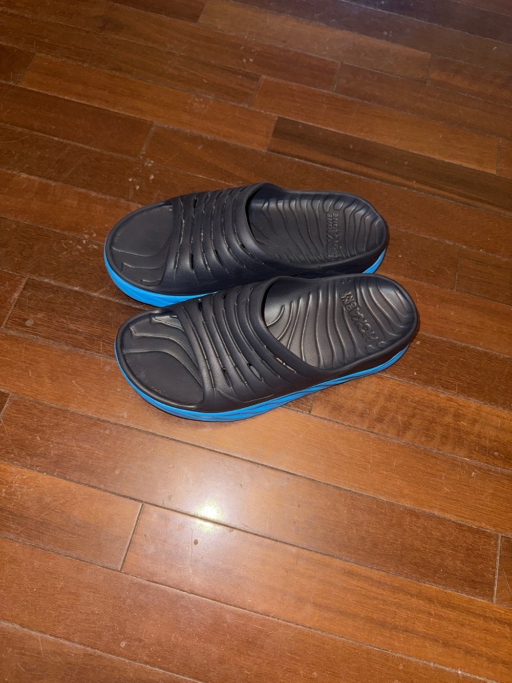 Hoka Men's Black Slide Sandals with Blue Midsoles